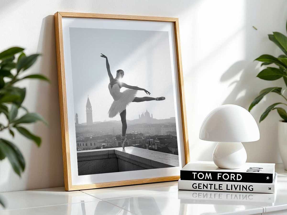 Silhouette of a ballerina on an open balcony overlooking a canal at dusk, softened by grain and paper texture