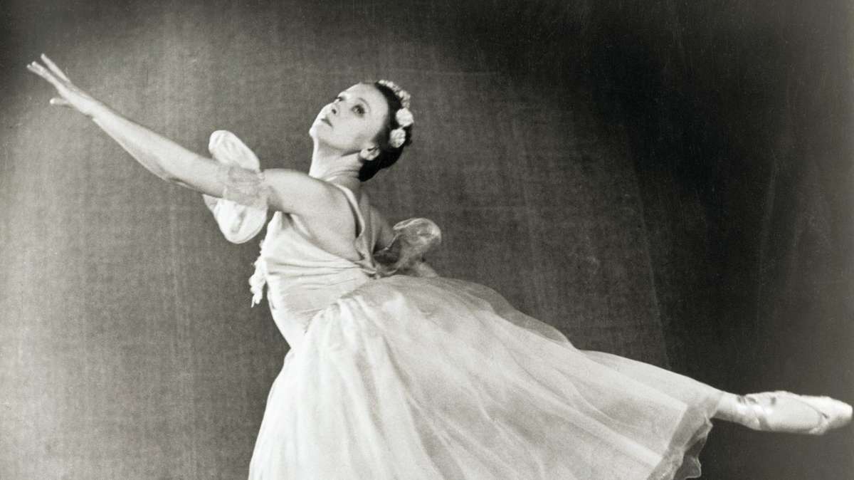 Studio portrait of Galina Ulanova in a simple rehearsal leotard, head slightly tilted, revealing her poised, introspective…