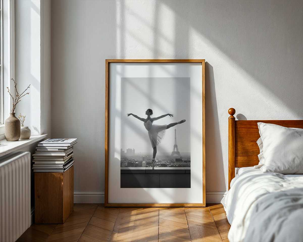 Silhouette of a ballerina on an ornate balcony against faded Parisian facades and soft film grain