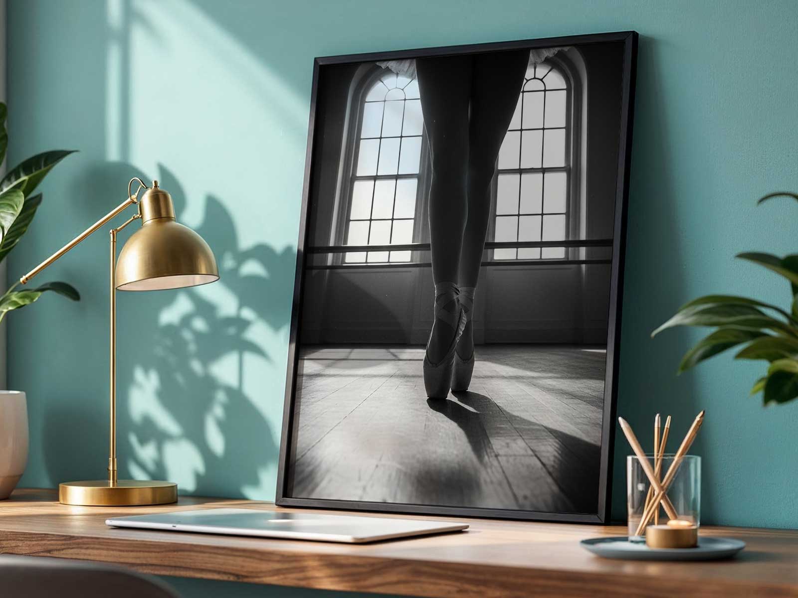 Ballet dancer in arabesque silhouette against soft studio light, emphasizing the line of the leg and lifted arm