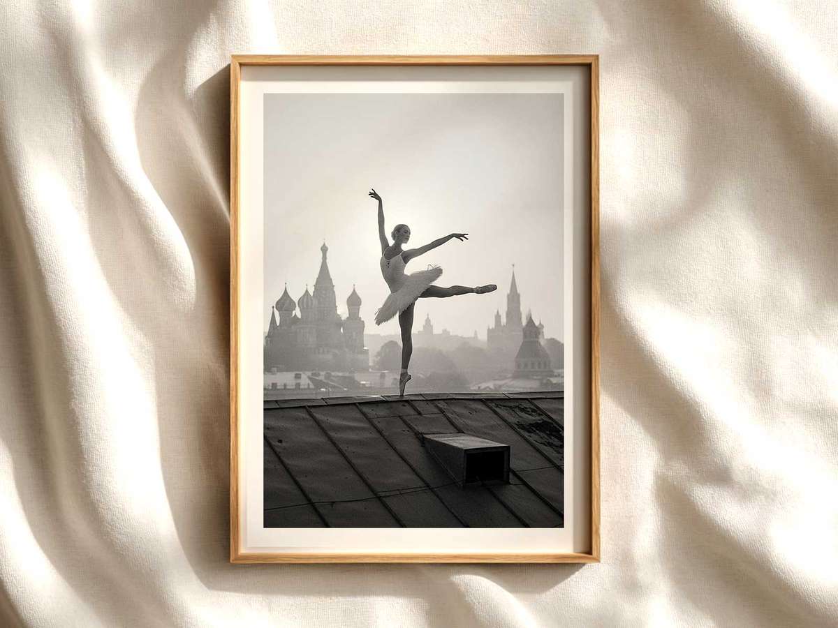 Ballerina in a soft, desaturated palette posed on a dim theater stage suggesting Moscow’s classical heritage