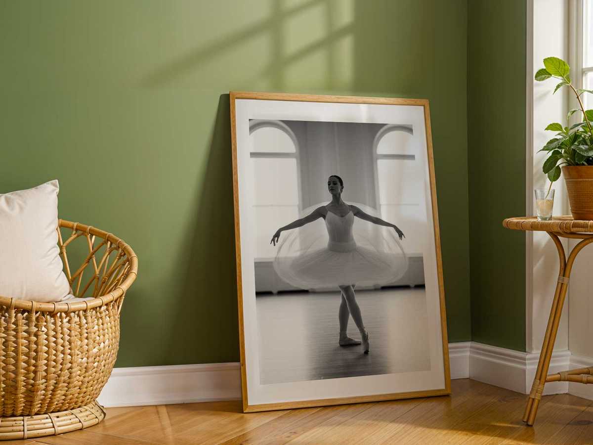 Detail of a dancer’s feet at the barre, pointed and flexed, conveying the foundational work that shapes larger expressive…