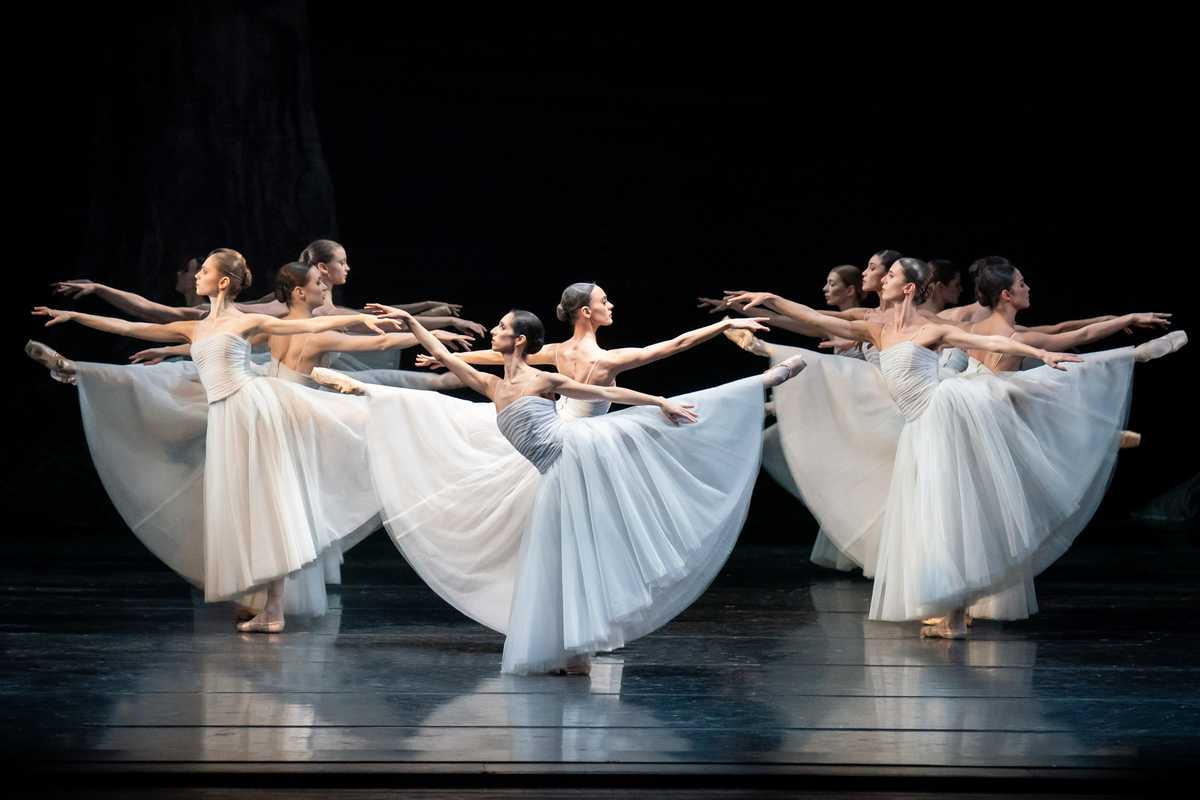 Giselle collapsing in a dramatic moment of madness as her grief and betrayal overwhelm her on stage