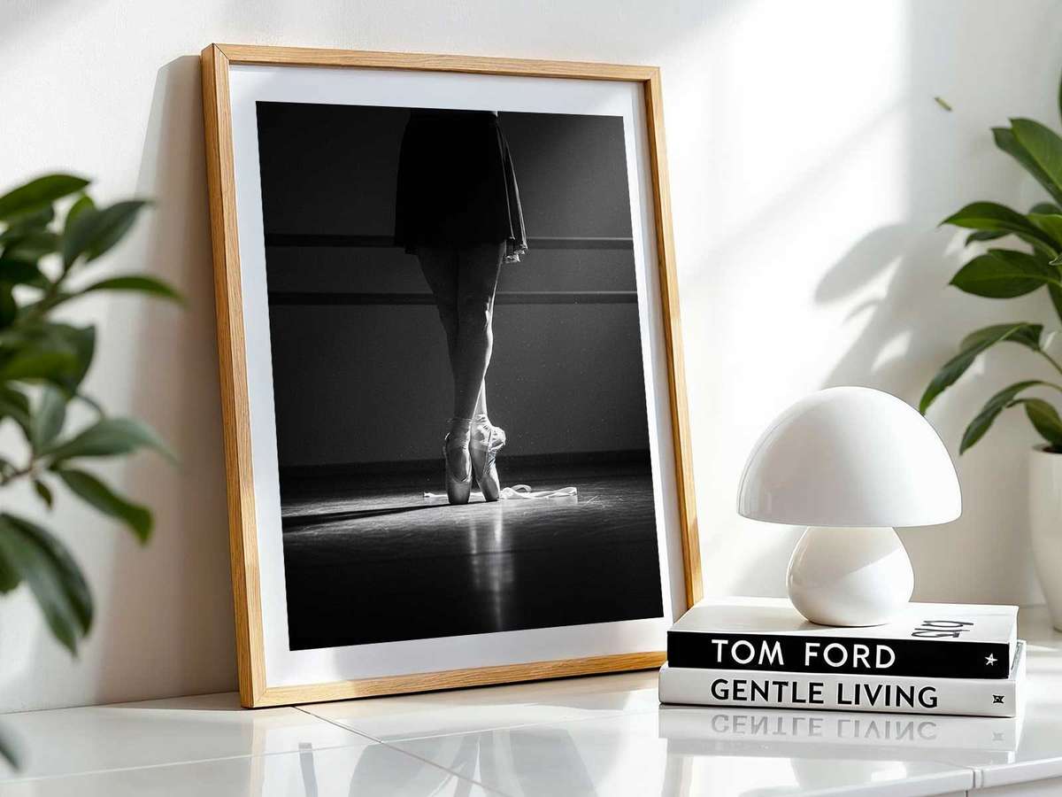 Close detail of a ballerina's hands and forearms pressing into the floor during a demanding studio exercise, veins and…