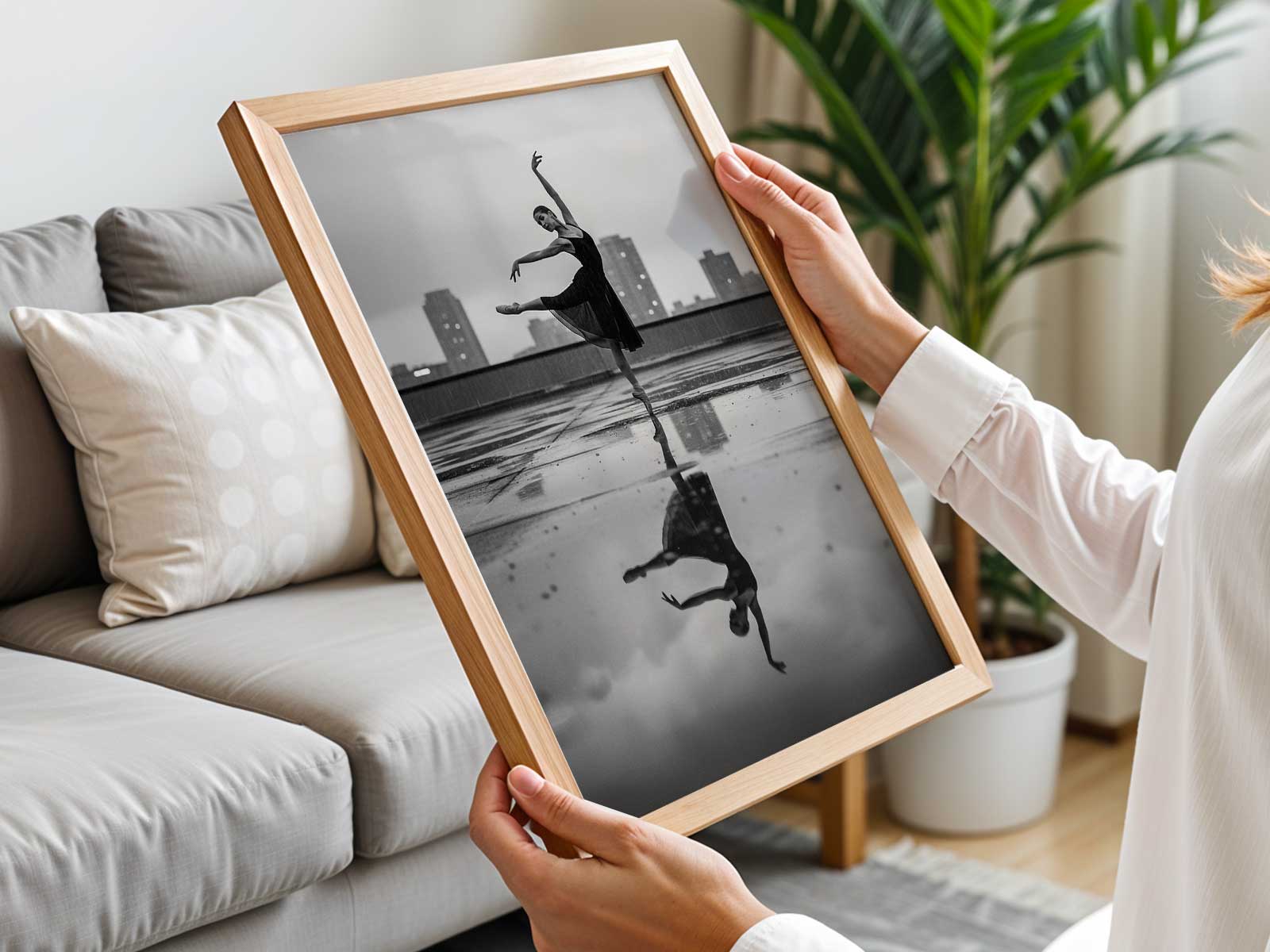 Close view of a ballerina framed by distant city depth, focus on neck carriage and extended arm line