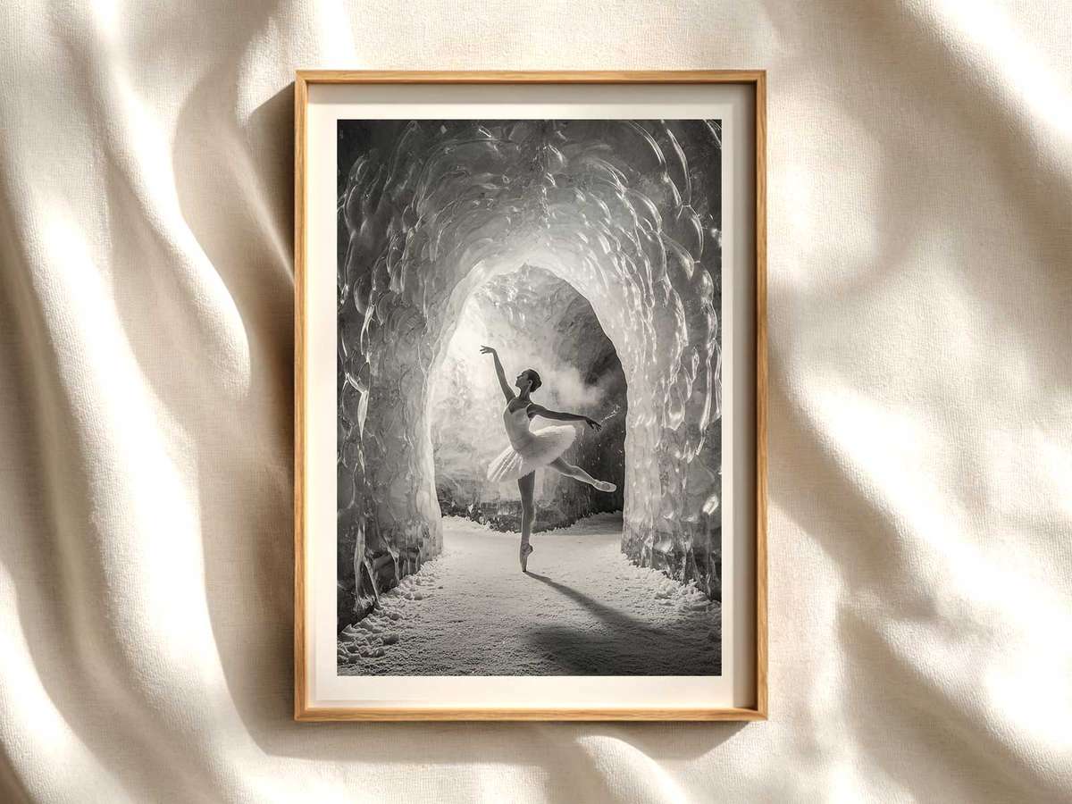 Ballerina silhouette on a dim winter stage with pale backlight and frosted set pieces