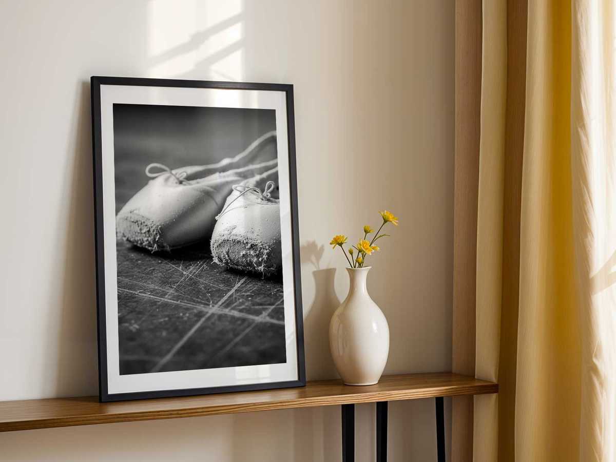 Geometric composition of a leg and pointe creating a clear visual rhythm