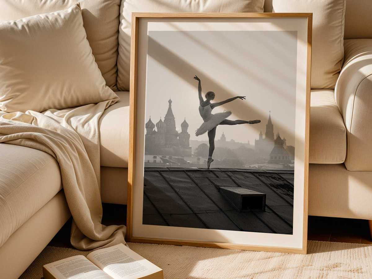 Wide view of a grand theater interior framing dancers on stage, combining monumental architecture and human scale