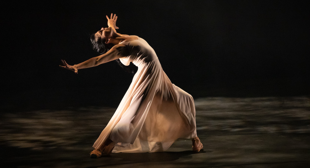 Natalia Osipova captured mid-air in a powerful grand jeté, showing explosive elevation and athletic extension