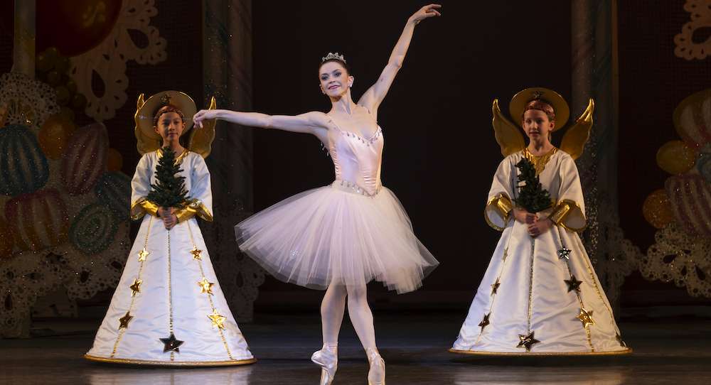 A corps de ballet arranged in a clean, geometric formation reflecting Balanchine’s emphasis on line and musicality