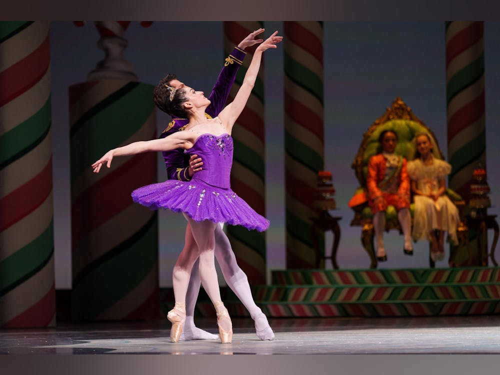 Pacific Northwest Ballet dancers on stage with orchestra in pit, highlighting musical collaboration
