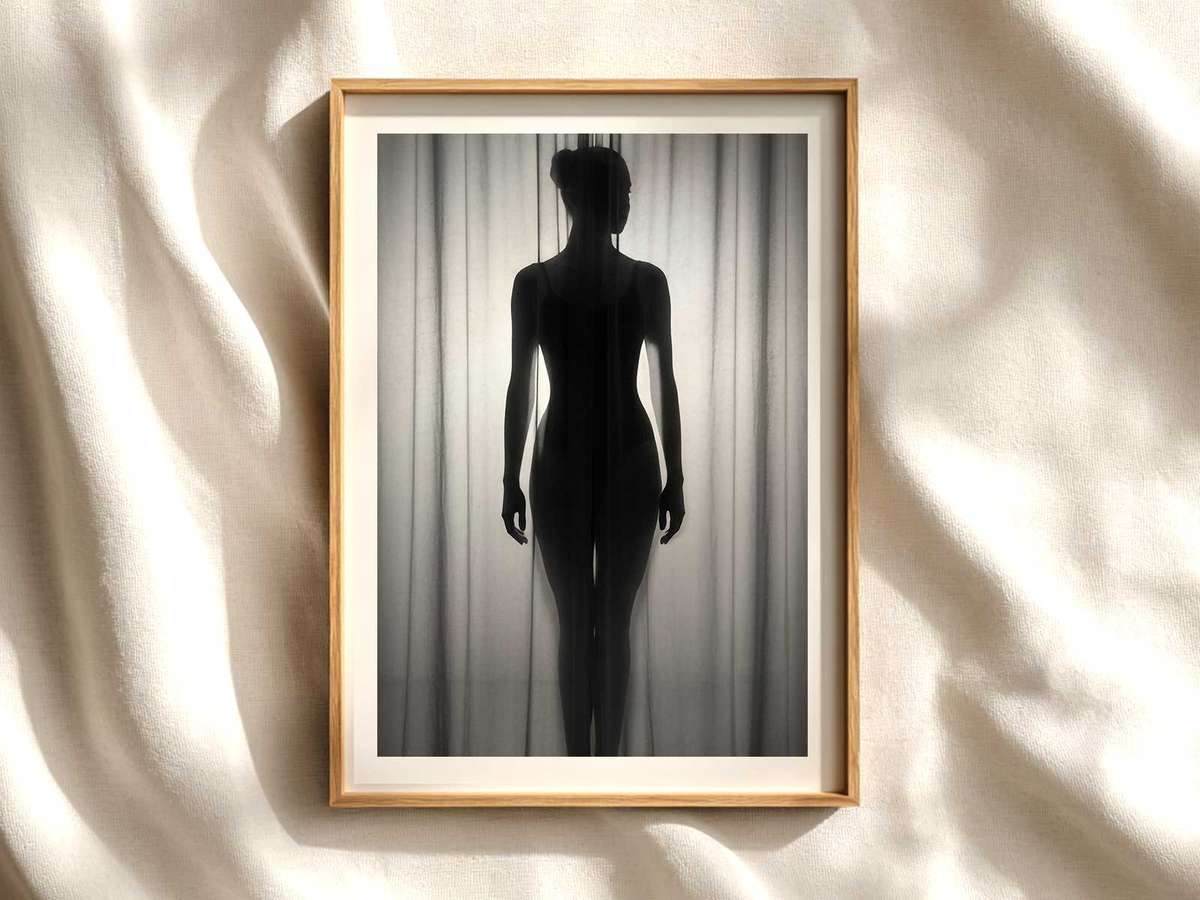 Ballerina with a soft veil draped over one shoulder emphasizing graceful neck and shoulder line