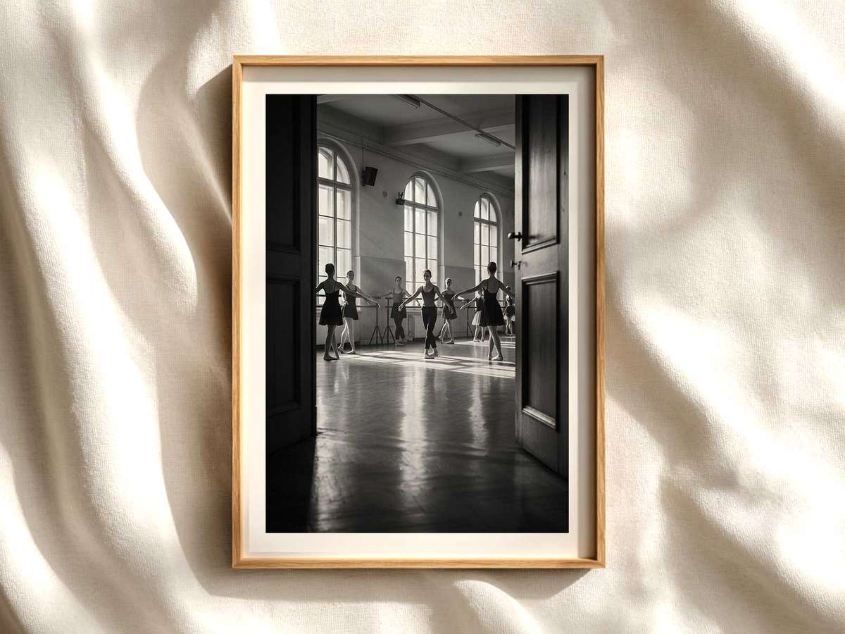 Ballet dancer holding a deep plié in a sunlit studio, muscles defined and line perfectly controlled