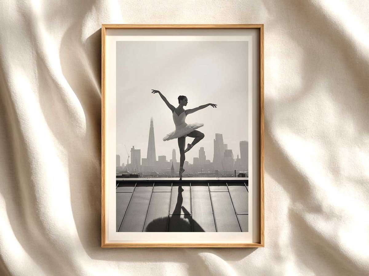 Ballerina posed on a wrought-iron balcony overlooking a misty London street, soft vintage tones and textured print effect