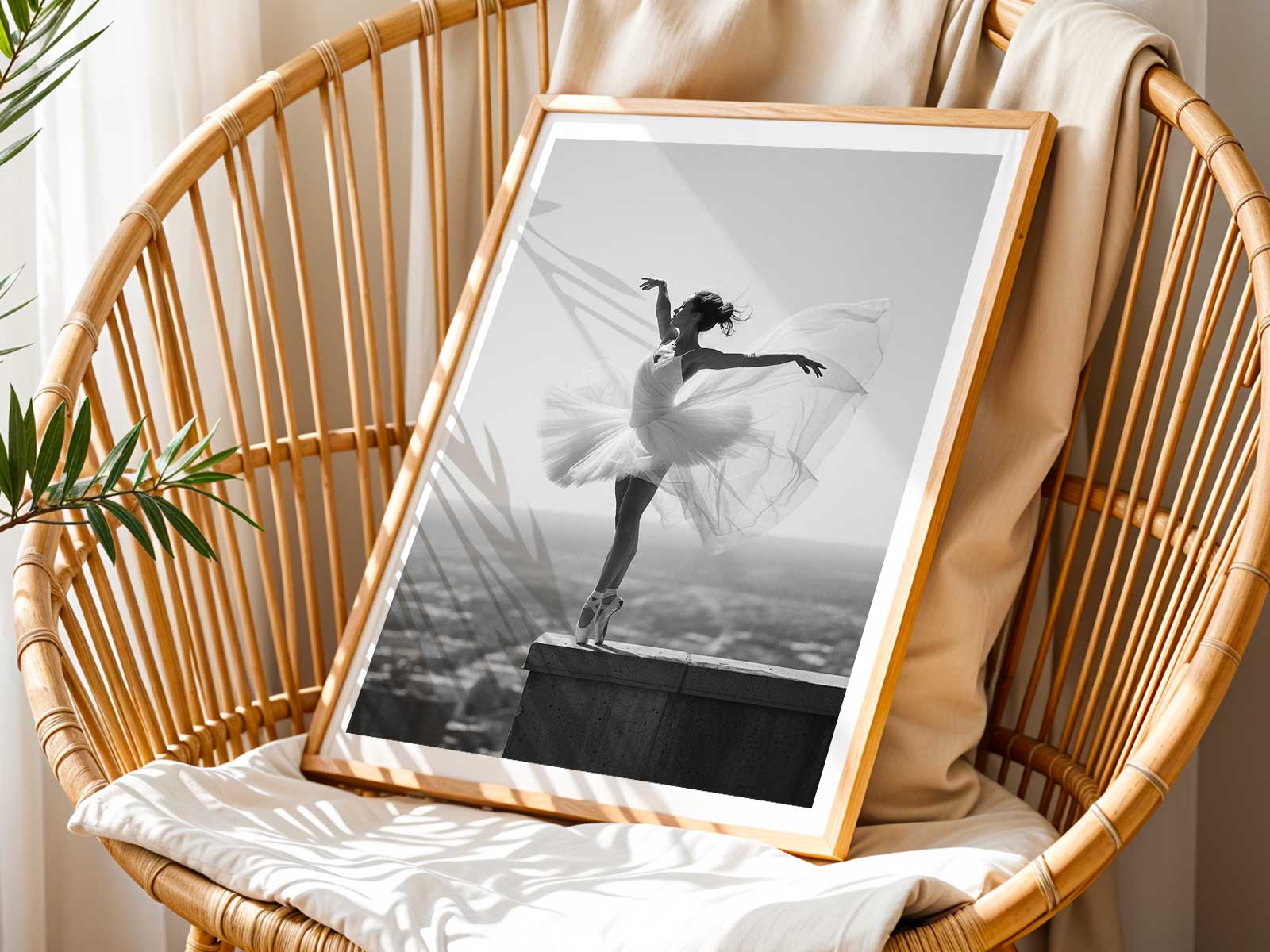 Ballerina in arabesque balancing on one leg with a calm, focused expression