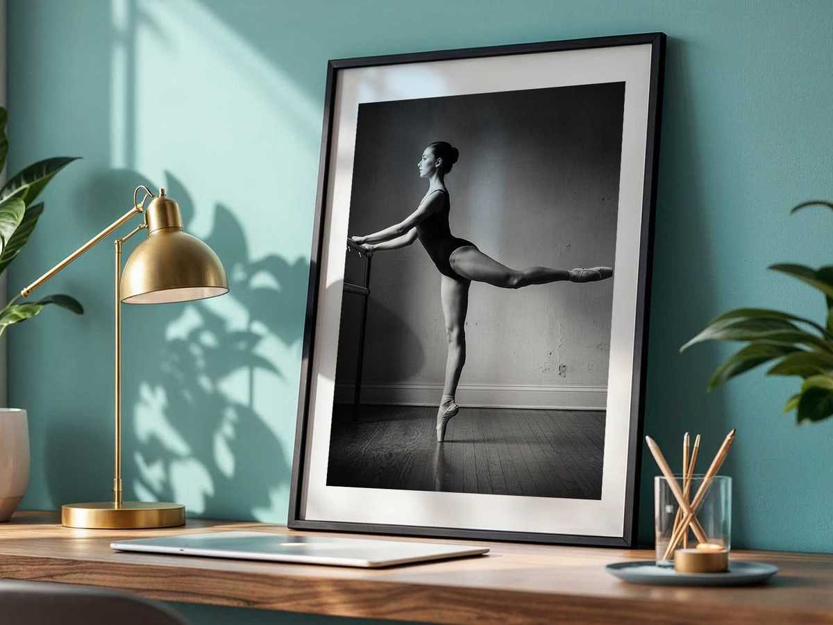 Dancer mid-stretch on the floor, expressing the measured calm of preparation and the simplicity of the studio environment