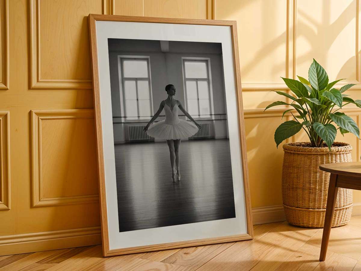 Ballerina rehearsing under soft overhead light, face serene and body poised, conveying restraint and introspective…