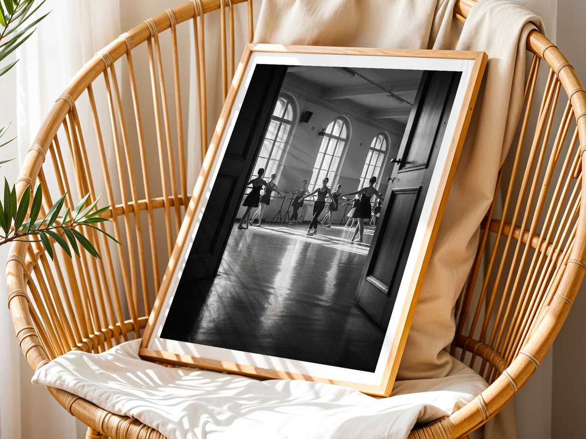 Portrait of a ballet dancer pausing between takes, breath visible and emotion present in the gaze