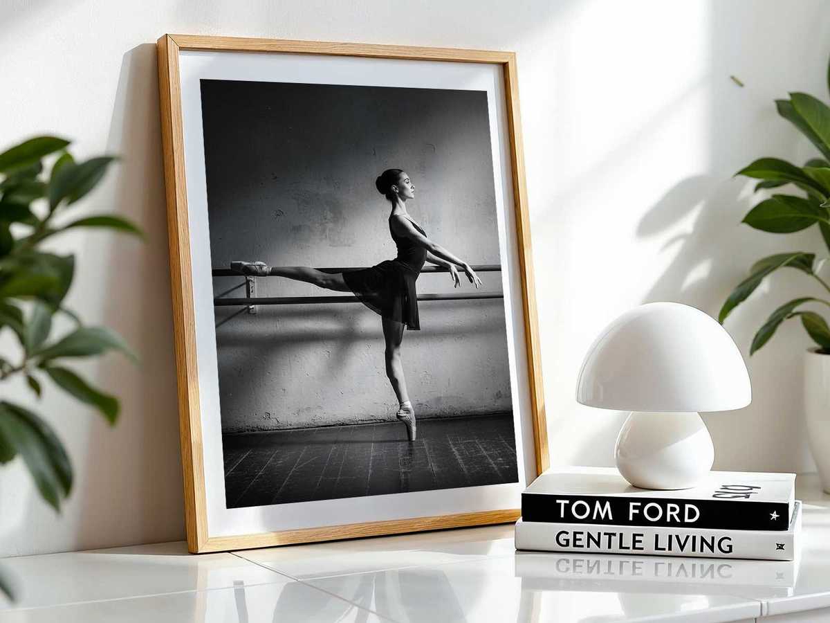 Backlit silhouette of a ballet dancer in a studio, highlighting line and form against bright windows