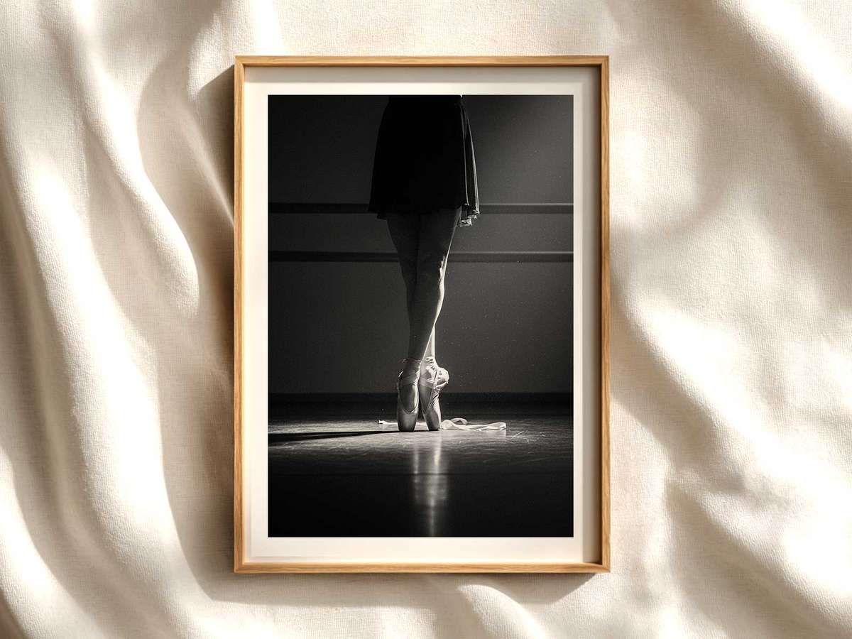 Ballerina captured mid-pirouette in a sunlit studio, muscles engaged and gaze focused, conveying concentrated intensity