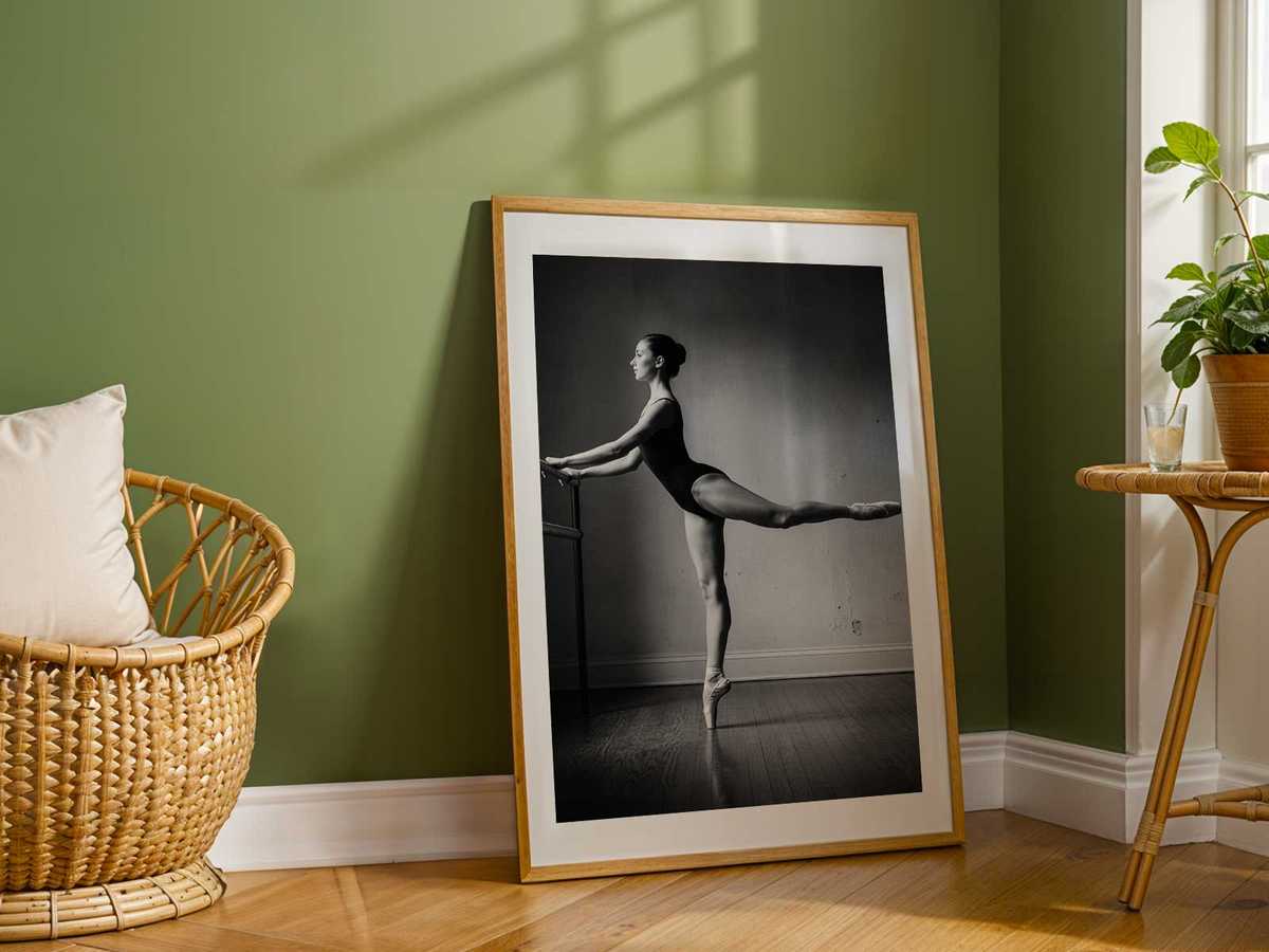 Ballet dancer framed by a broad studio window, contrast between bright outside light and the quiet interior practice
