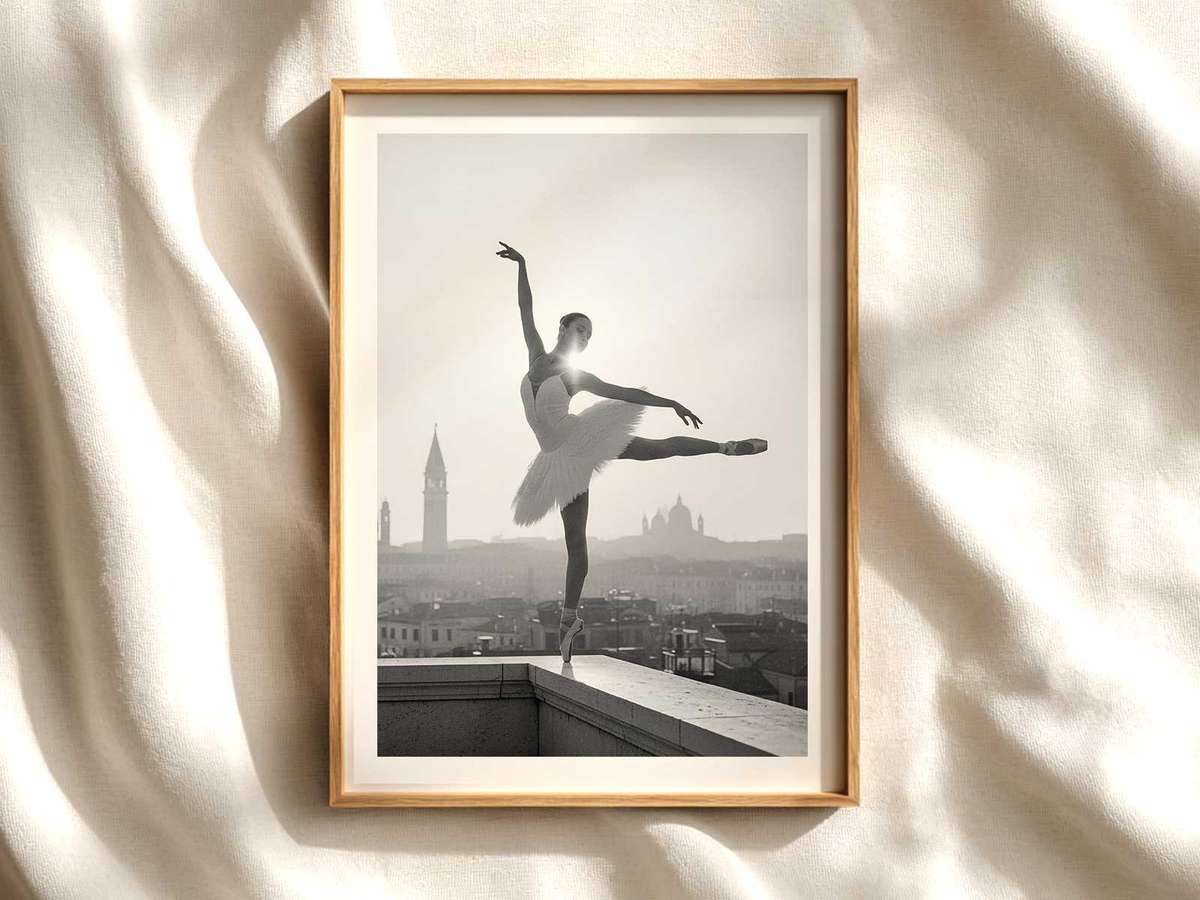 A ballerina posed on a small Venetian stage set with painted gondolas and muted gold drapery, wearing a vintage tutu