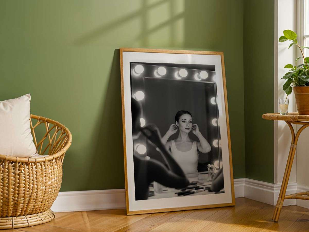 Portrait showing two angles of the same ballerina through a mirror, one poised and one vulnerable