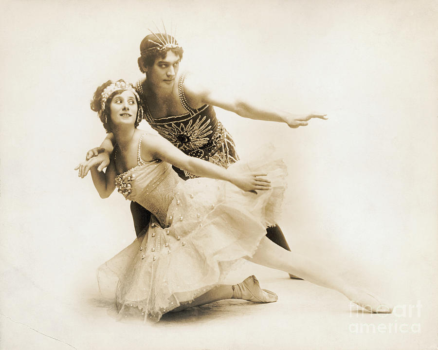 Black and white portrait of Anna Pavlova in a high-collared costume, soft lighting highlighting her delicate features
